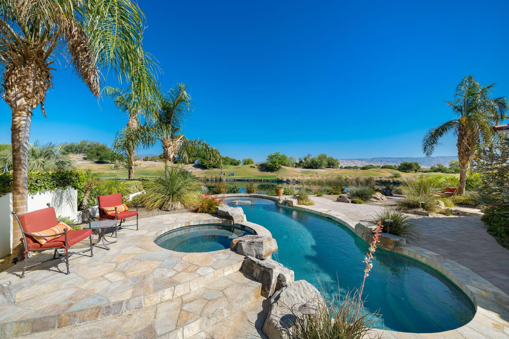 372 Loch Lomond Road Rancho Mirage, CA 92270 - Photo 35 of 51 a view of a swimming pool and lounge chair