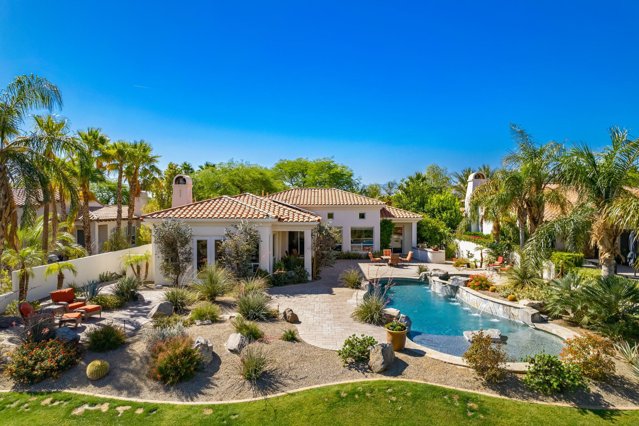 372 Loch Lomond Road Rancho Mirage, CA 92270 - Photo 36 of 51 a view of a house with swimming pool and sitting area