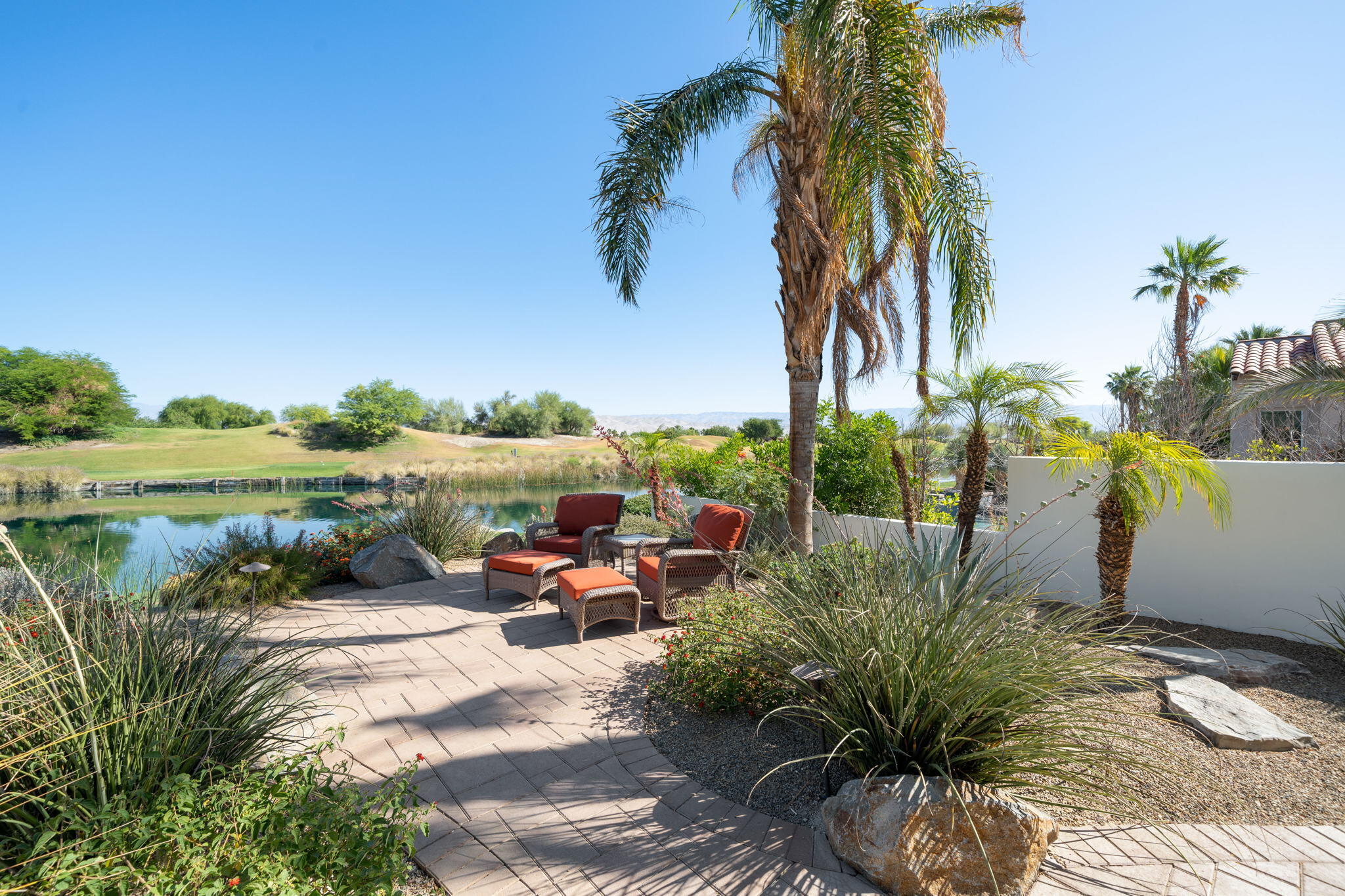 372 Loch Lomond Road Rancho Mirage, CA 92270 - Photo 38 of 51 a view of a lake with outdoor seating space