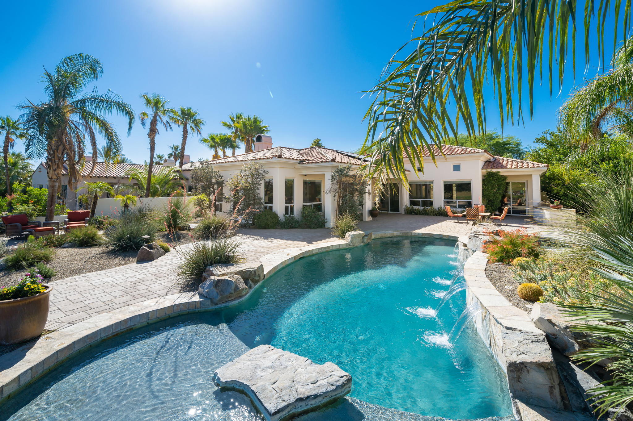 372 Loch Lomond Road Rancho Mirage, CA 92270 - Photo 43 of 51 a view of a house with a yard and potted plants