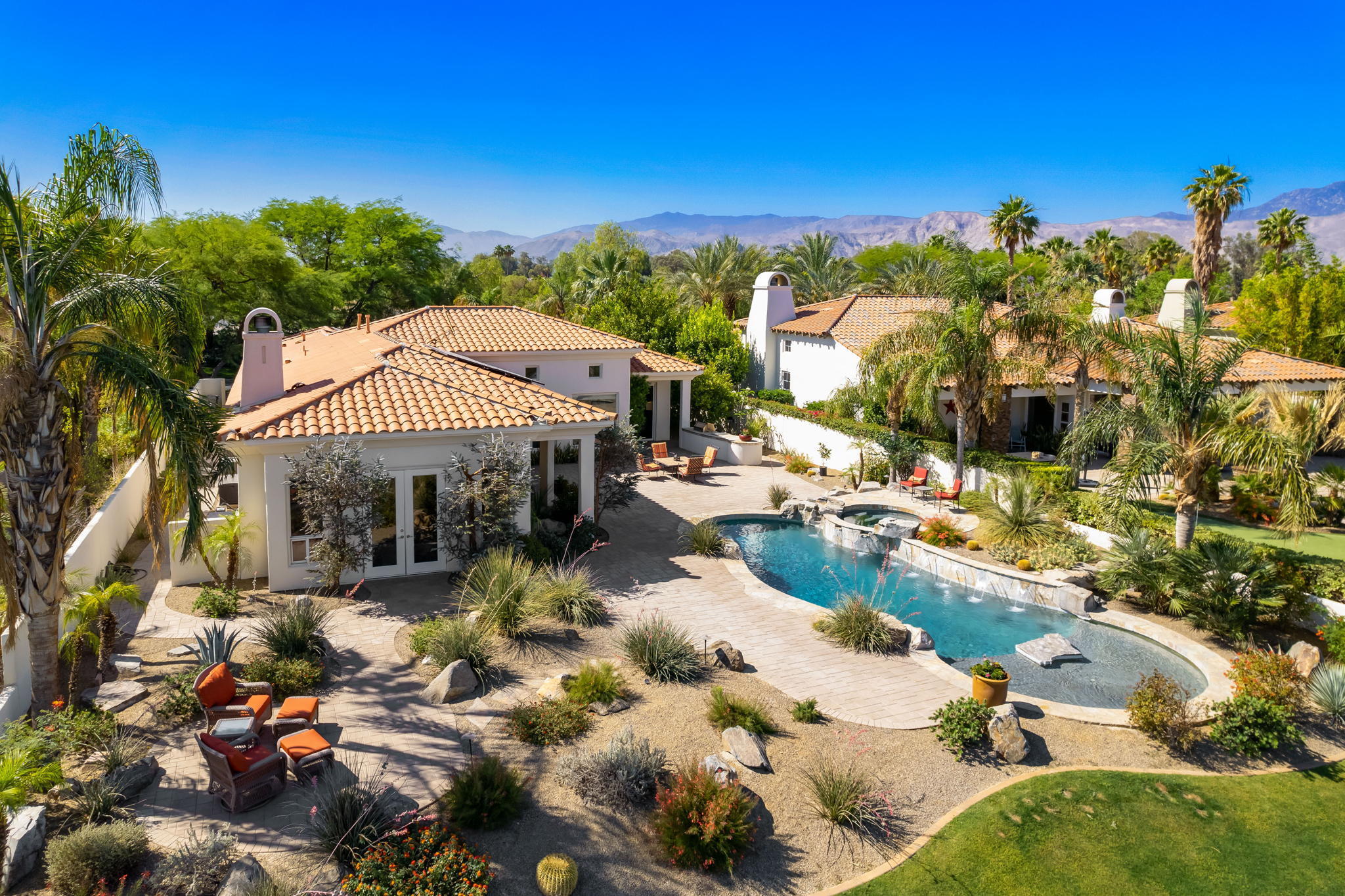 372 Loch Lomond Road Rancho Mirage, CA 92270 - Photo 45 of 51 a view of a patio with swimming pool table and chairs
