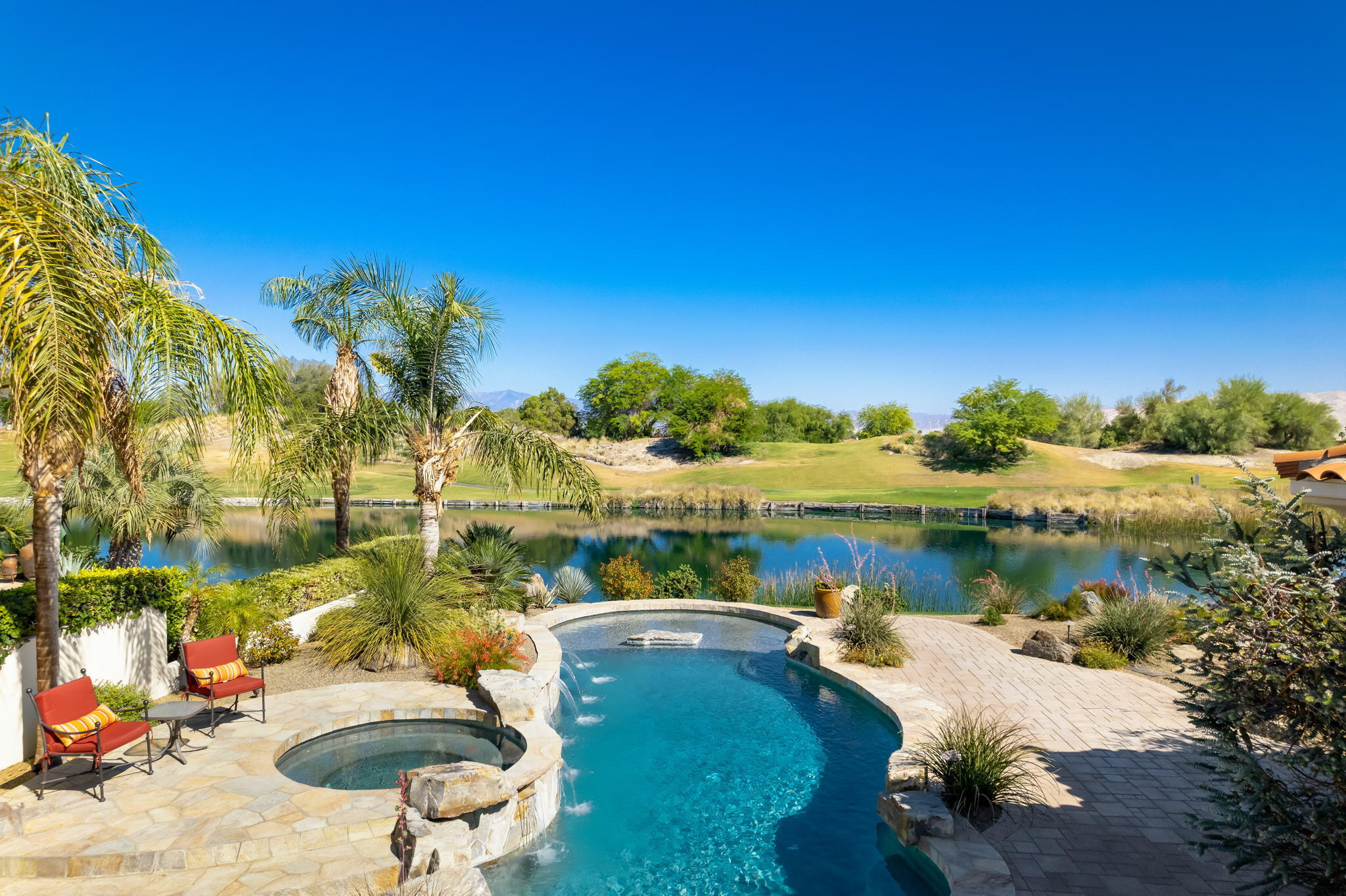 372 Loch Lomond Road Rancho Mirage, CA 92270 - Photo 48 of 51 a view of a lake in between two chairs