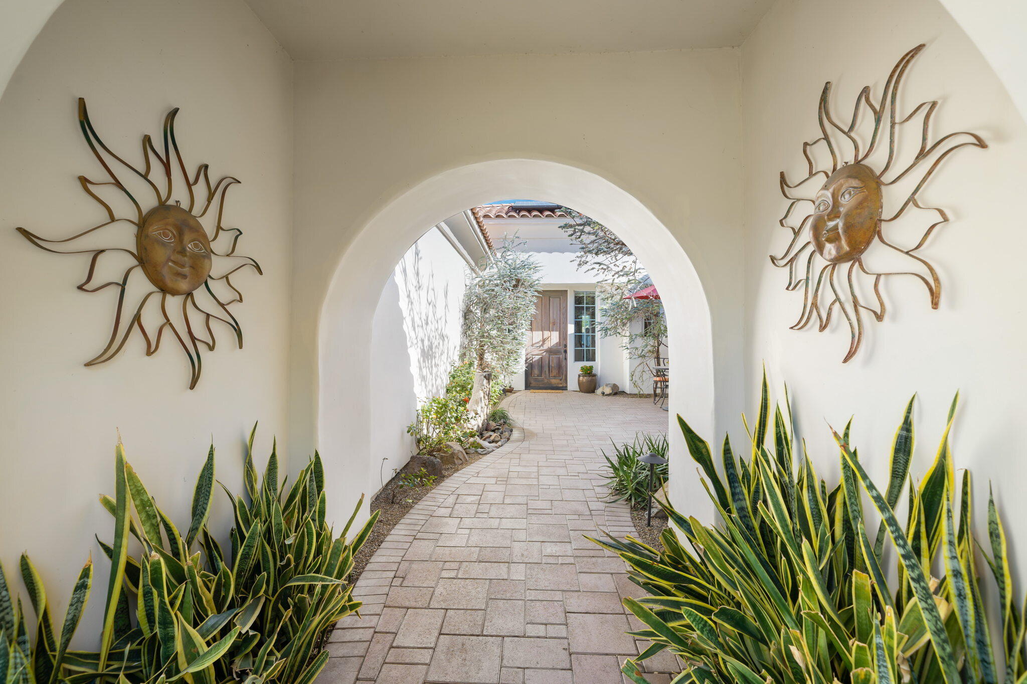 372 Loch Lomond Road Rancho Mirage, CA 92270 - Photo 5 of 51 a lobby with a potted plant and a large window