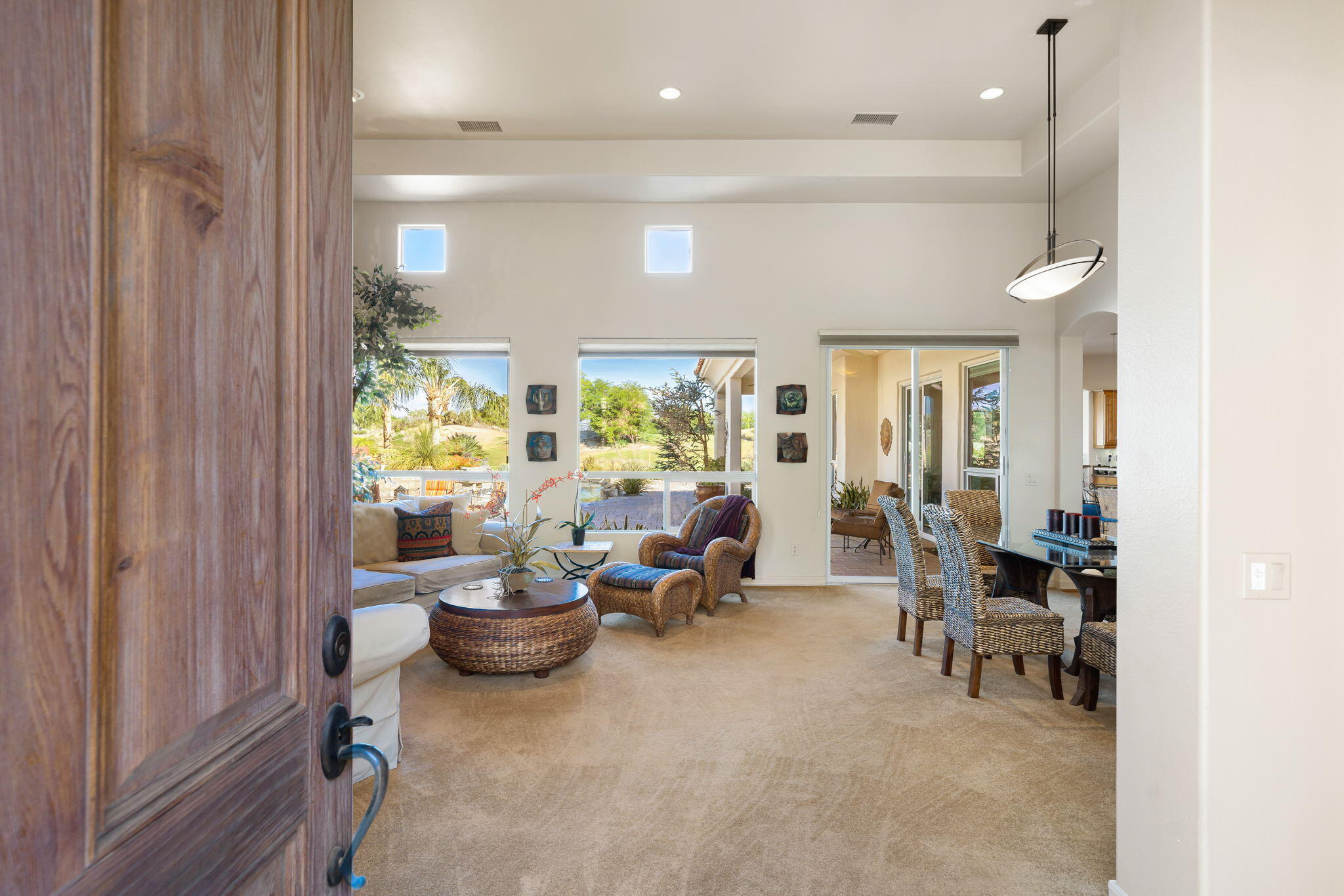 372 Loch Lomond Road Rancho Mirage, CA 92270 - Photo 7 of 51 a living room with furniture and a potted plant