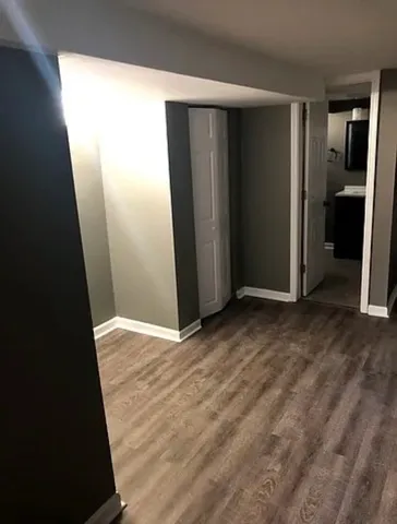 an empty room with wooden door