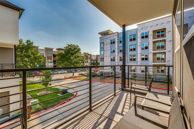 a view of balcony with wooden floor