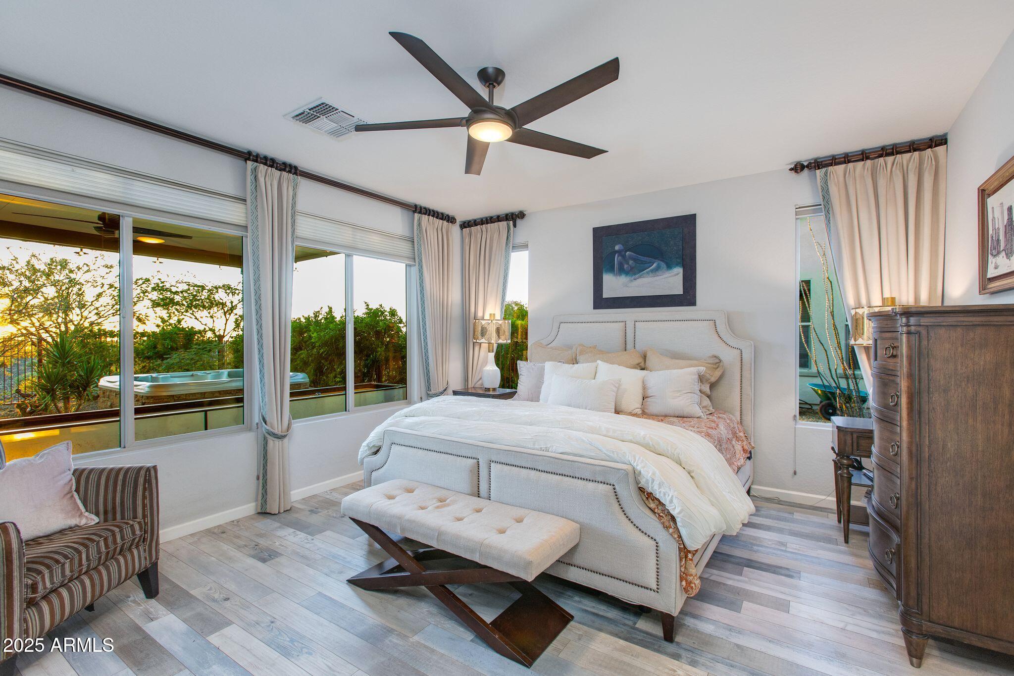 3800 Gold Ridge Road Wickenburg, AZ 85390 - Photo 21 of 51 a bedroom with a bed and a large window