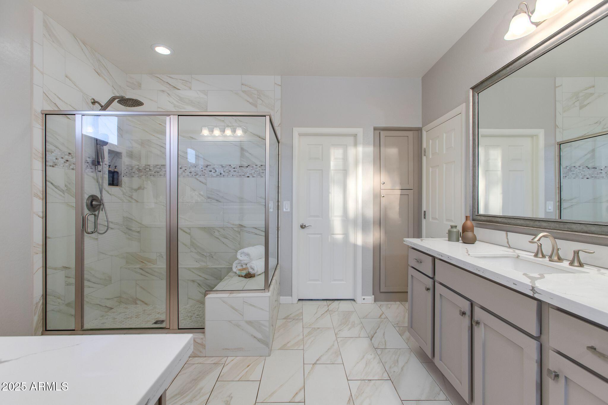 3800 Gold Ridge Road Wickenburg, AZ 85390 - Photo 25 of 51 a bathroom with a granite countertop sink a shower and a mirror