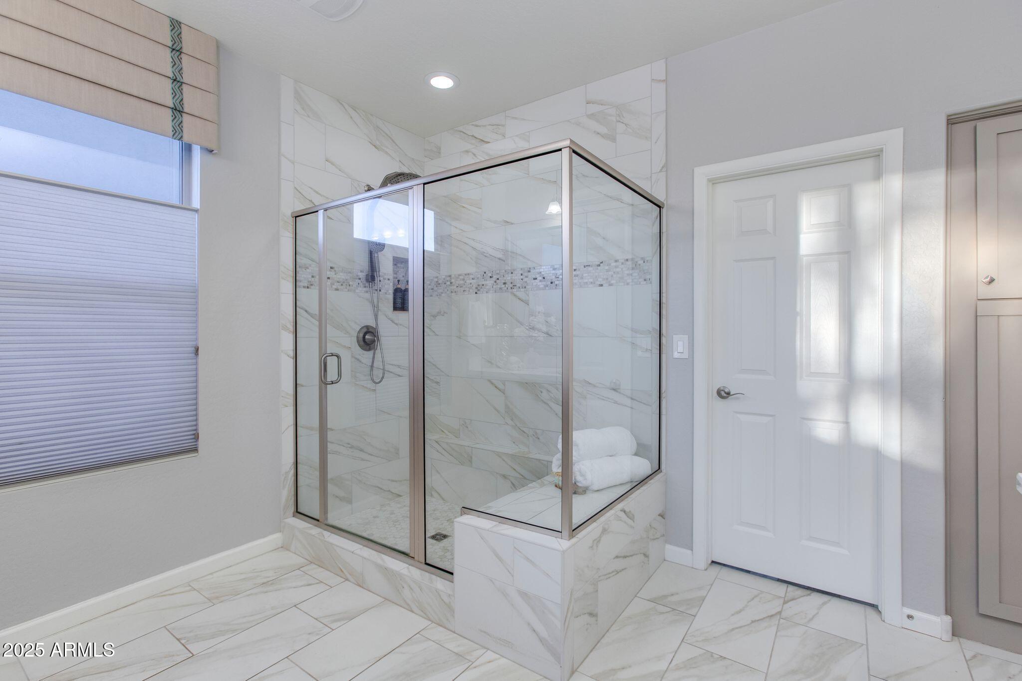 3800 Gold Ridge Road Wickenburg, AZ 85390 - Photo 26 of 51 a bathroom with a shower and a glass door