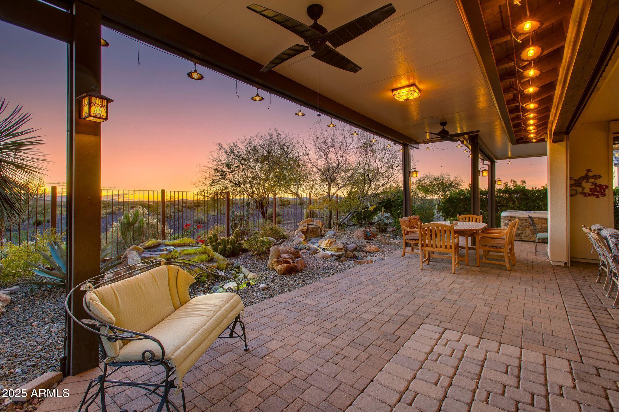 3800 Gold Ridge Road Wickenburg, AZ 85390 - Photo 33 of 51 a view of a patio with a table and chairs and a barbeque