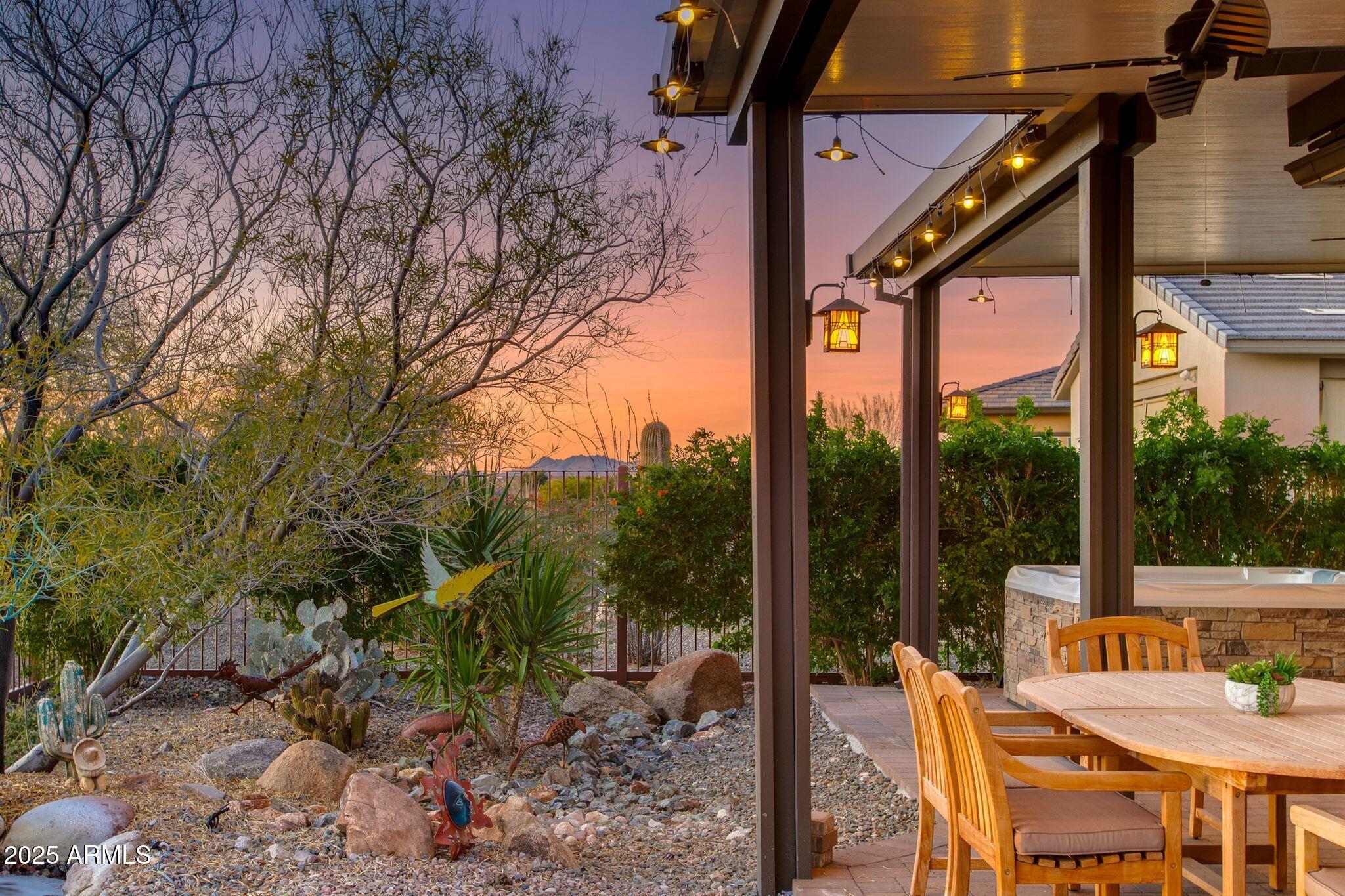 3800 Gold Ridge Road Wickenburg, AZ 85390 - Photo 35 of 51 a view of a patio with a table chairs and a backyard