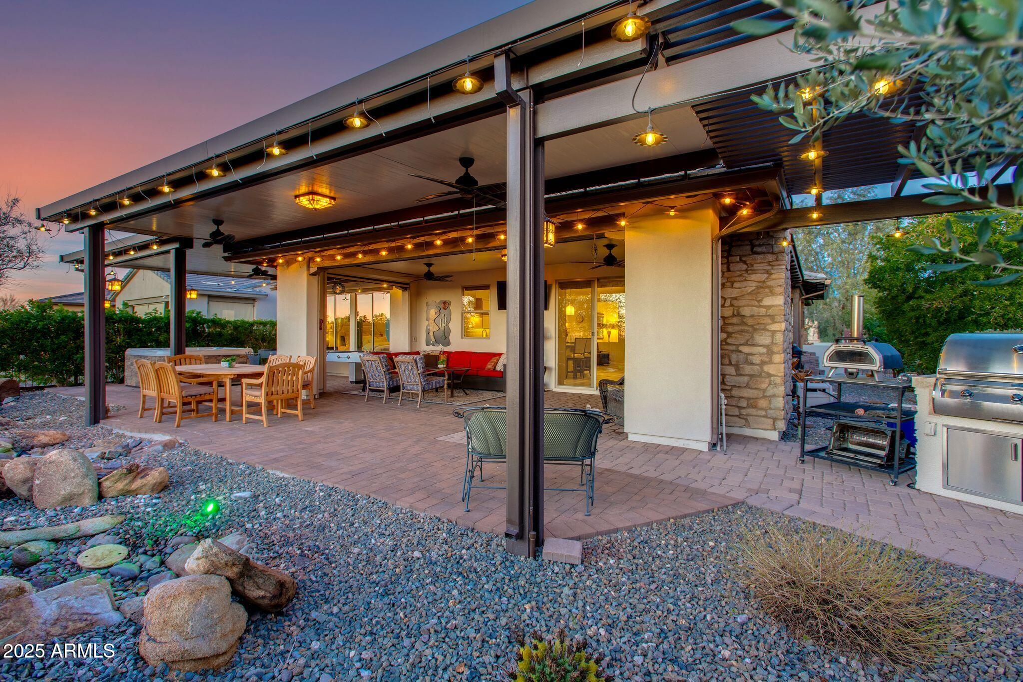3800 Gold Ridge Road Wickenburg, AZ 85390 - Photo 36 of 51 a view of a patio with table and chairs potted plants
