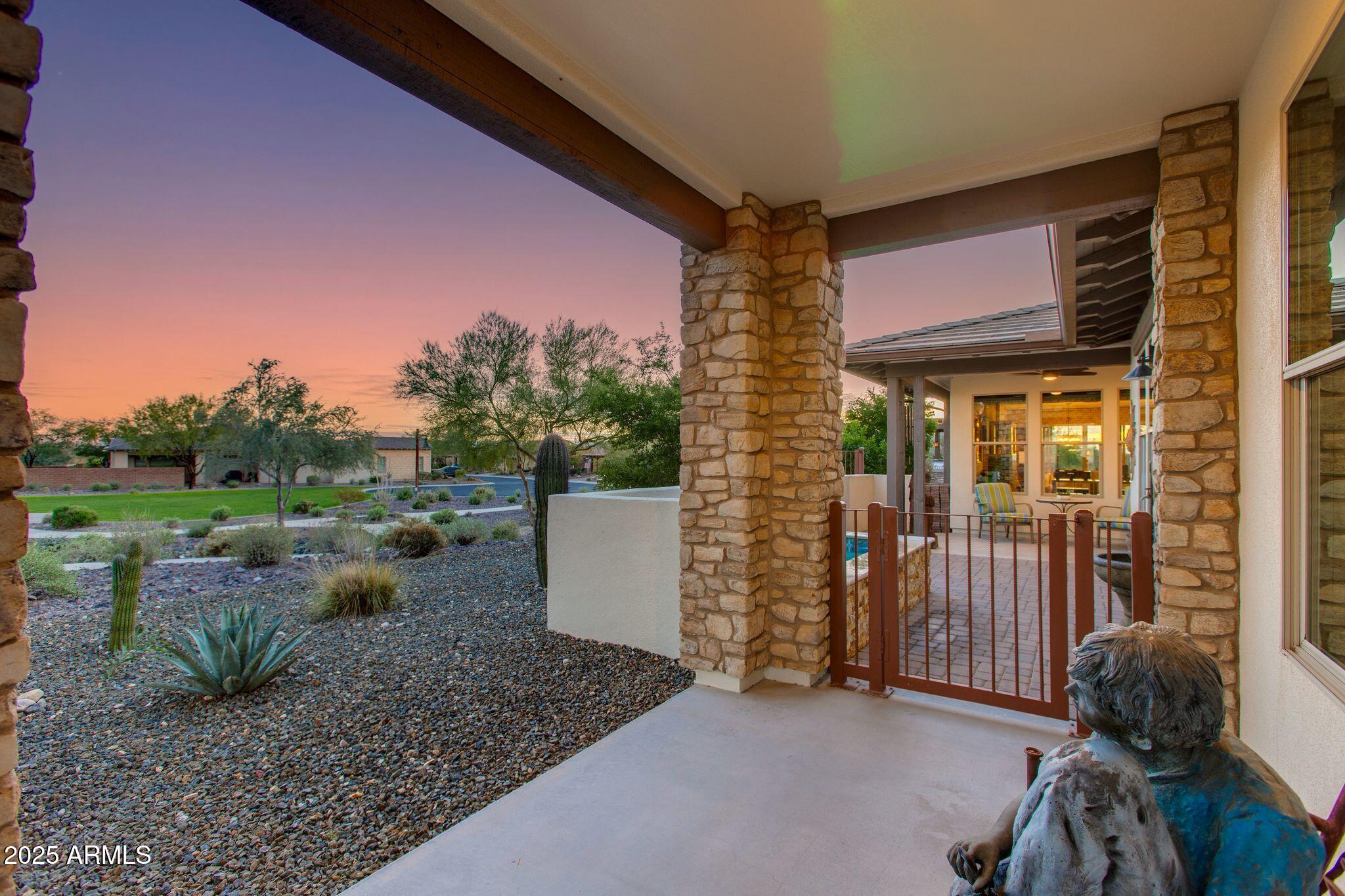 3800 Gold Ridge Road Wickenburg, AZ 85390 - Photo 4 of 51 a view of a porch with furniture and a yard