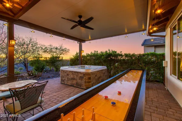 a view of a garden with an outdoor seating