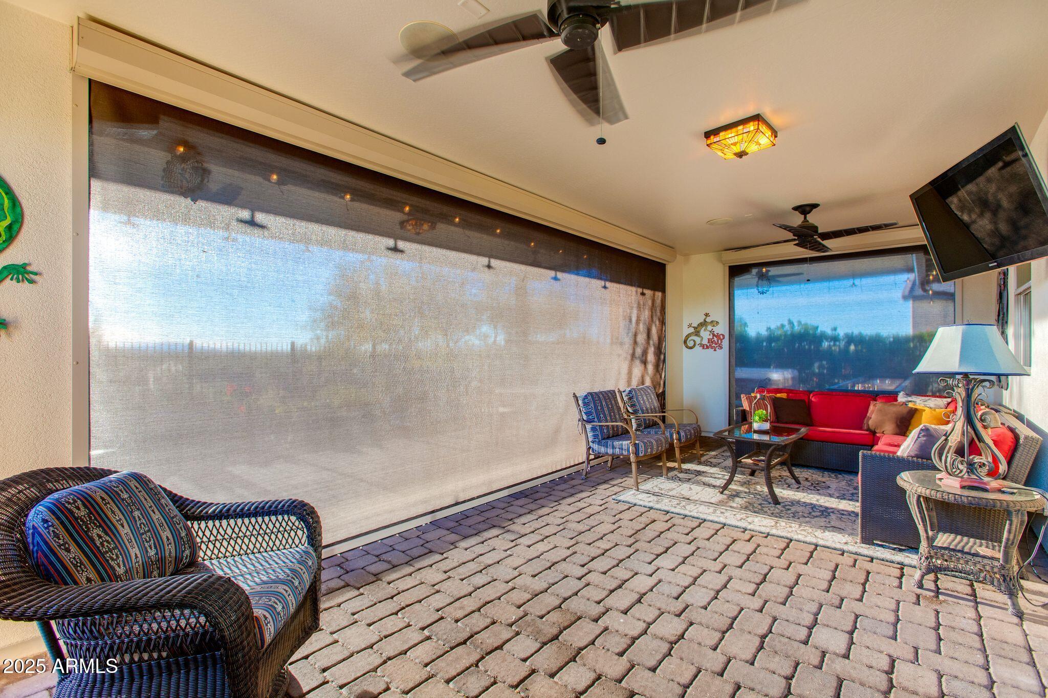 3800 Gold Ridge Road Wickenburg, AZ 85390 - Photo 43 of 51 a living room with furniture and a flat screen tv