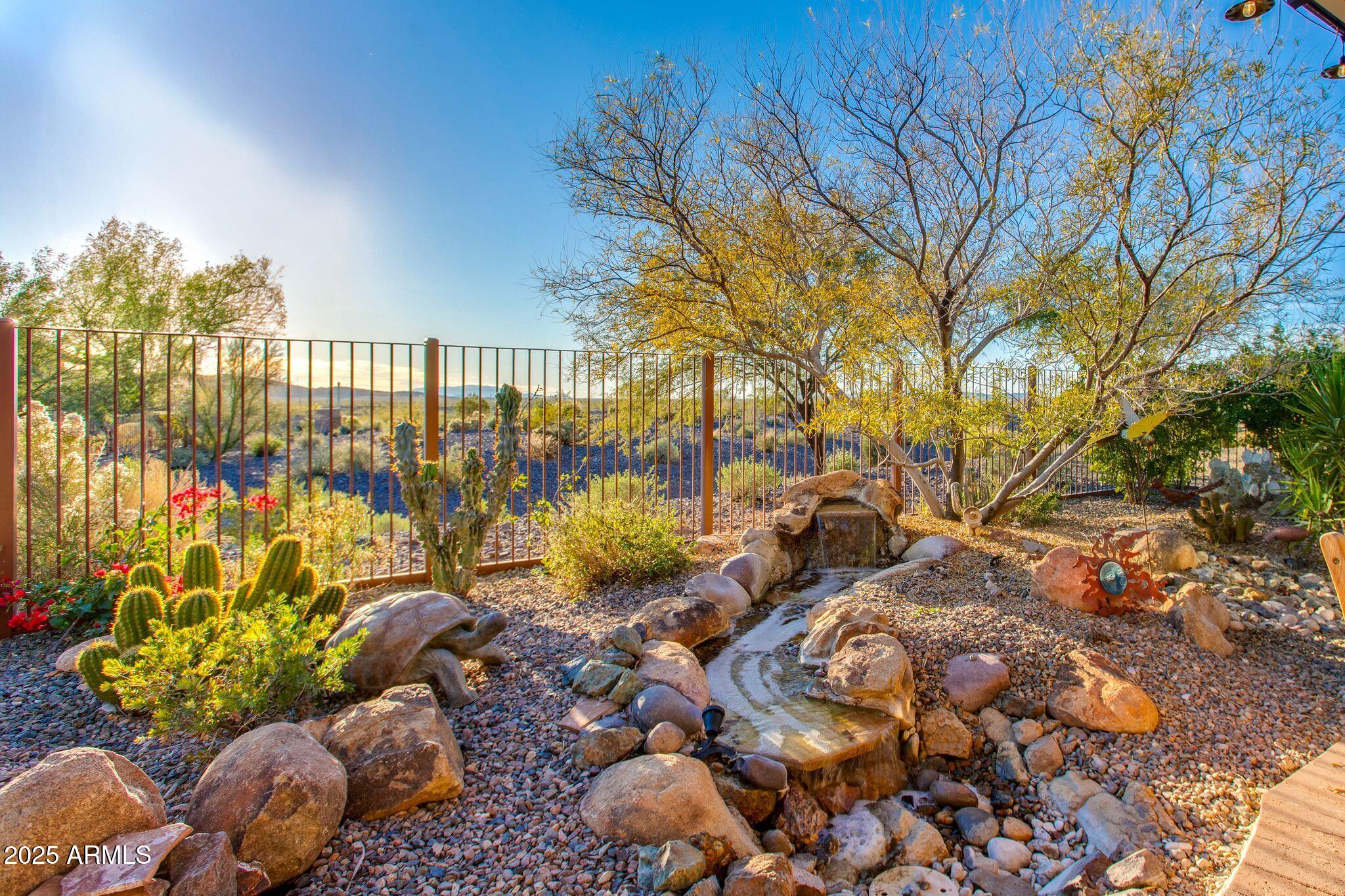3800 Gold Ridge Road Wickenburg, AZ 85390 - Photo 49 of 51 a view of a garden with an outdoor seating