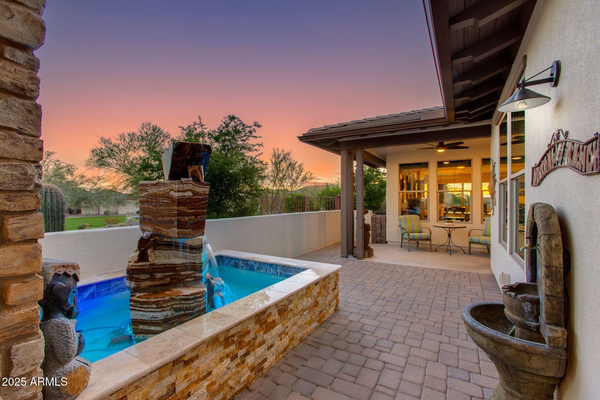 3800 Gold Ridge Road Wickenburg, AZ 85390 - Photo 5 of 51 a view of a patio with table and chairs a barbeque grill with wooden fence