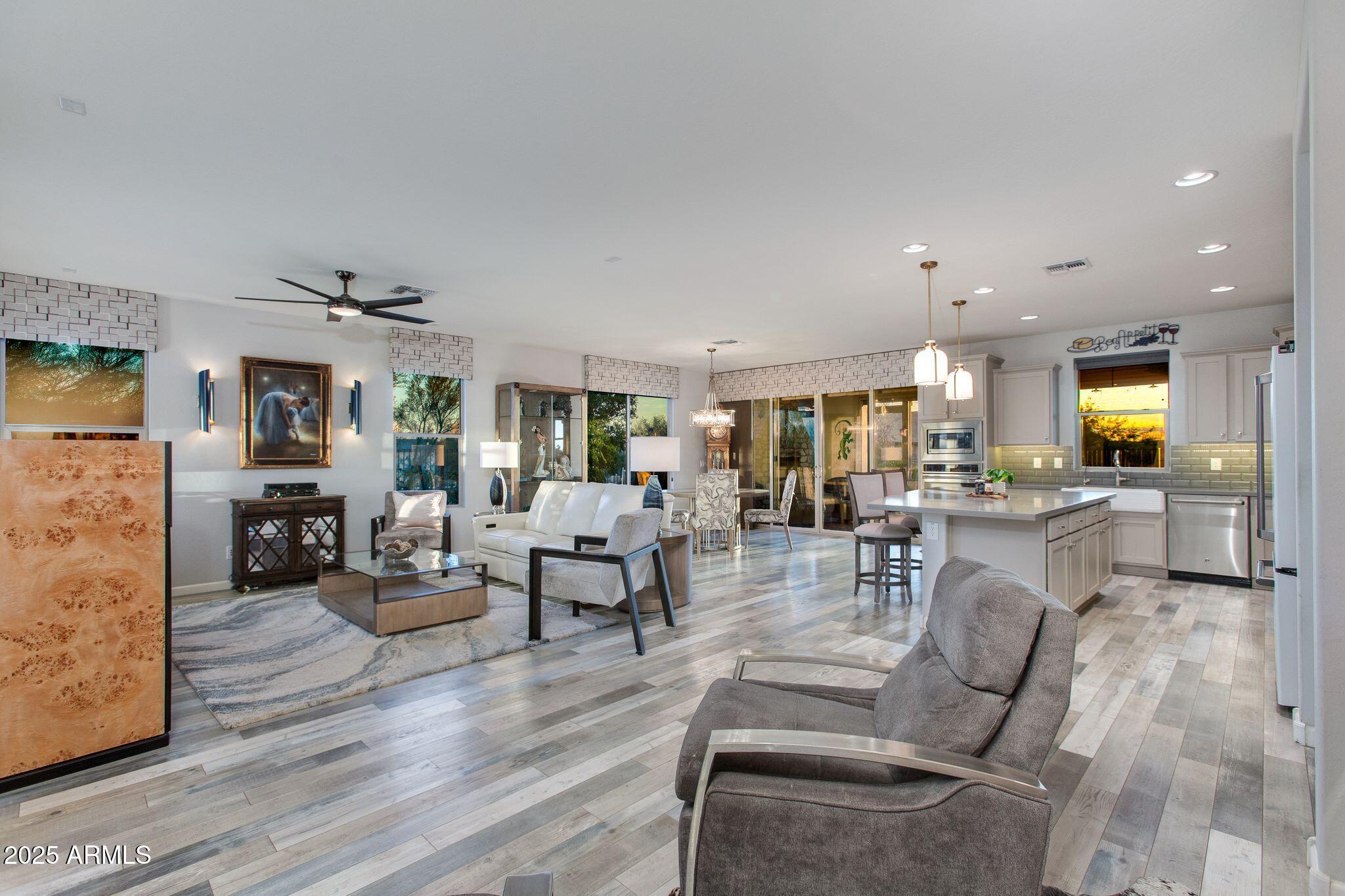 3800 Gold Ridge Road Wickenburg, AZ 85390 - Photo 8 of 51 a living room with fireplace furniture and wooden floor