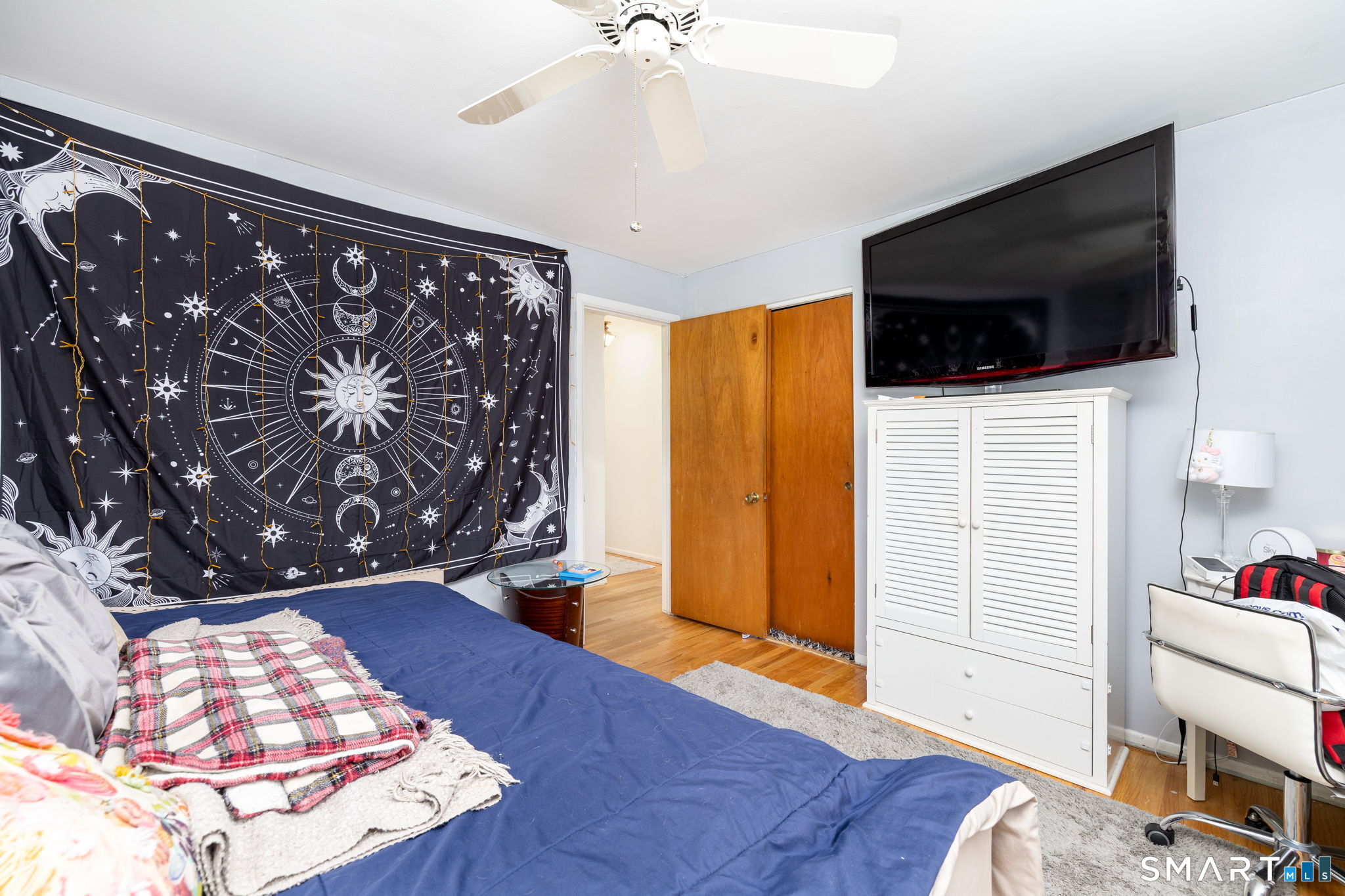 325 Barbara Road Middletown, CT 06457 - Photo 29 of 40 a view of a livingroom with wooden floor and a flat screen tv