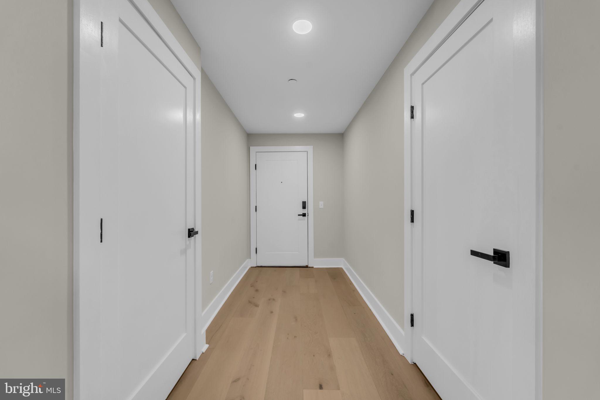 919 12th Street Northeast, Unit A301 Washington, DC 20002 - Photo 11 of 28 a view of a hallway with wooden floor