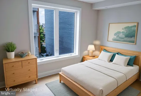 a bedroom with a bed and window