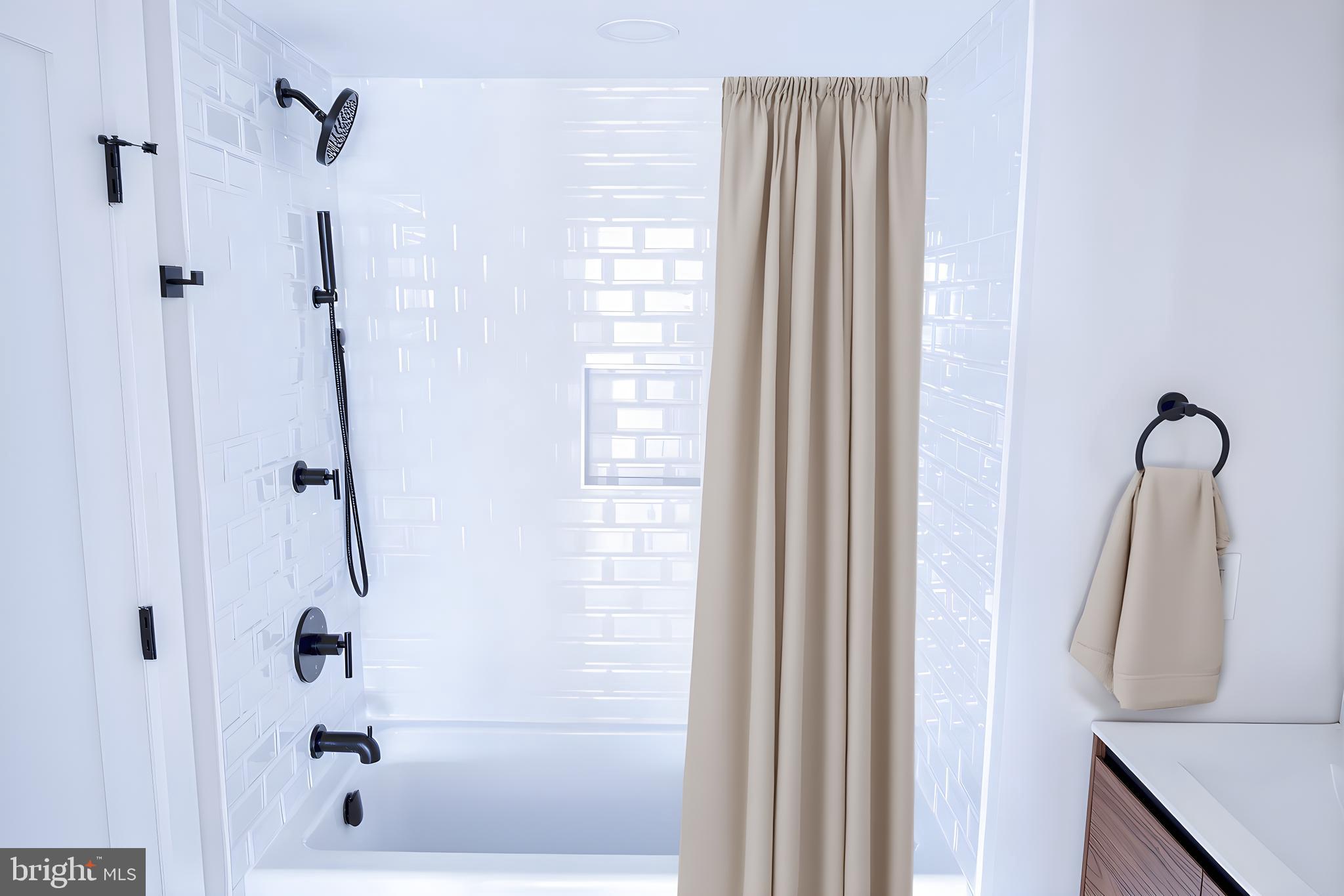 919 12th Street Northeast, Unit A301 Washington, DC 20002 - Photo 22 of 28 a bathroom with a shower