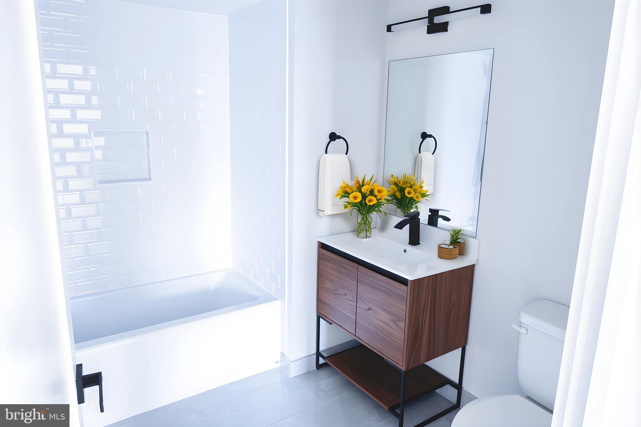 919 12th Street Northeast, Unit A301 Washington, DC 20002 - Photo 23 of 28 a bathroom with a sink and a bathtub