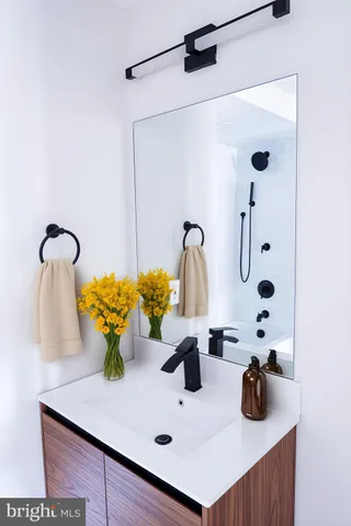 a bathroom with a sink and a mirror