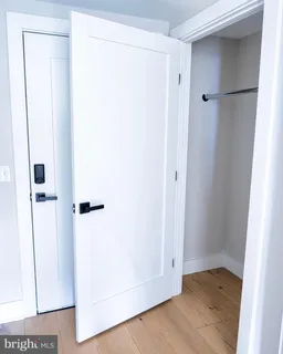 a view of a small space with wooden floor