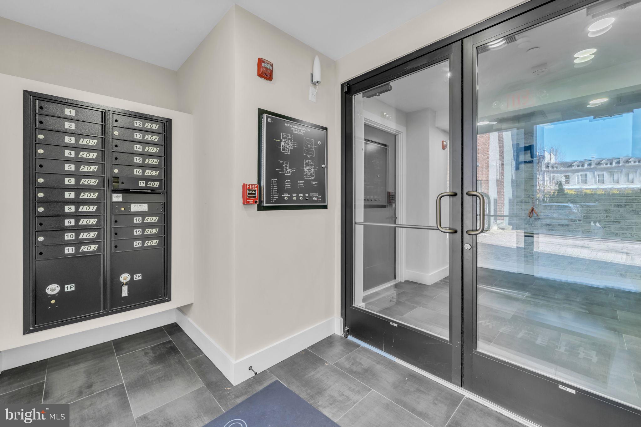 919 12th Street Northeast, Unit A301 Washington, DC 20002 - Photo 7 of 28 a bathroom with a glass shower door