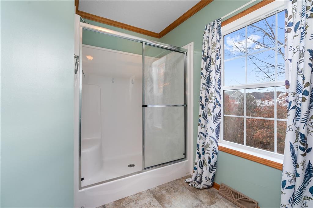743 Slate Avenue Cranberry Township, PA 16066 - Photo 19 of 32 a bathroom with a glass shower door