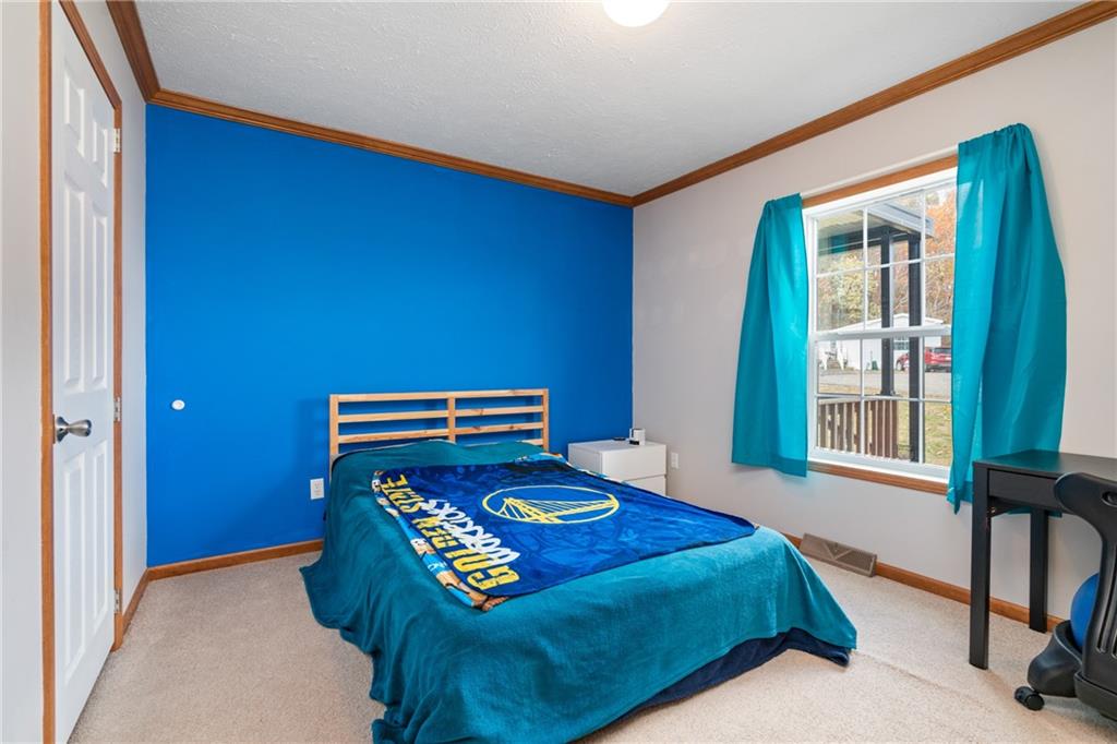 743 Slate Avenue Cranberry Township, PA 16066 - Photo 20 of 32 a bedroom with a bed and a window