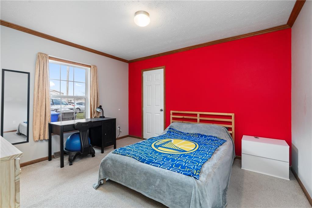 743 Slate Avenue Cranberry Township, PA 16066 - Photo 23 of 32 a bedroom with furniture and a window