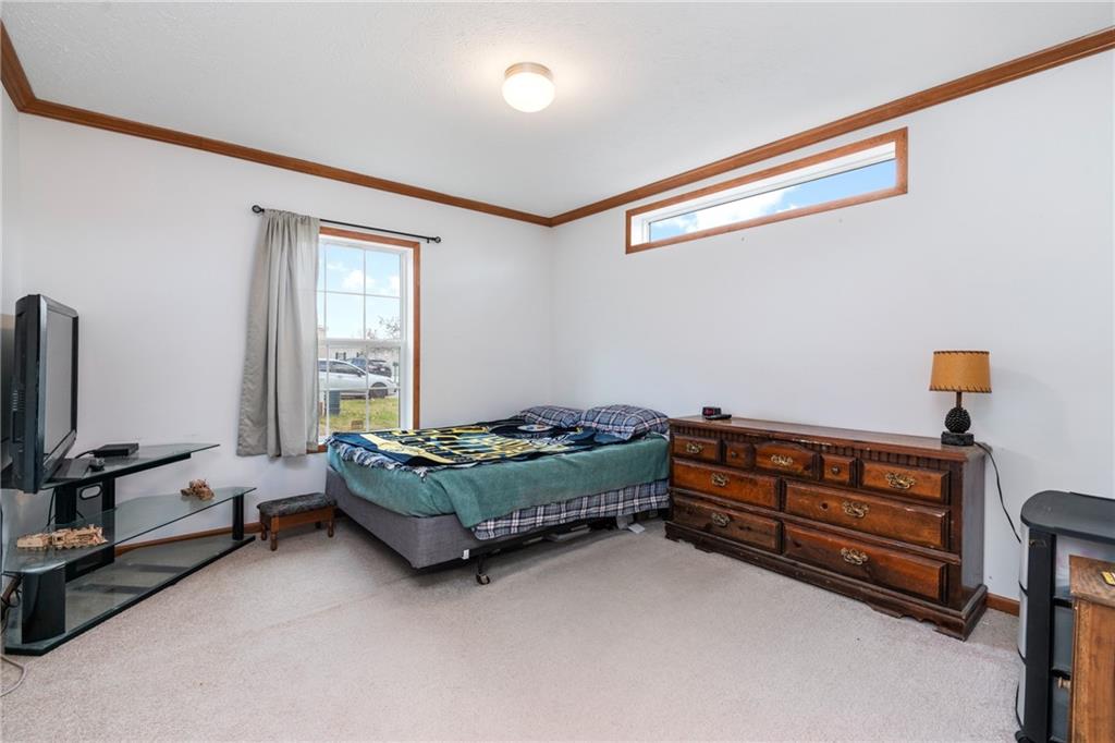 743 Slate Avenue Cranberry Township, PA 16066 - Photo 25 of 32 a bedroom with furniture and a window