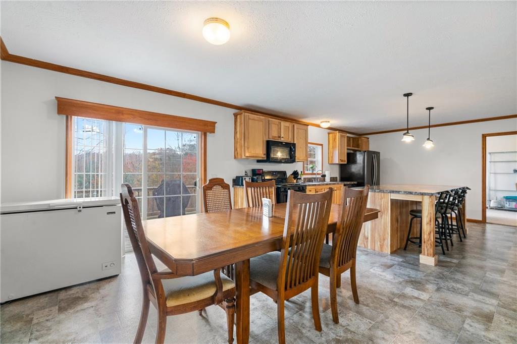 743 Slate Avenue Cranberry Township, PA 16066 - Photo 10 of 32 a dining room with furniture and wooden floor