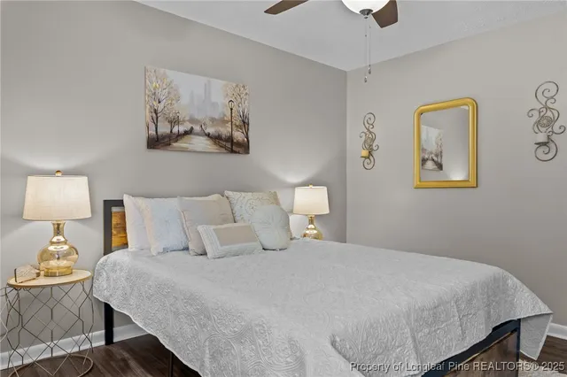 a bedroom with a bed and lamp