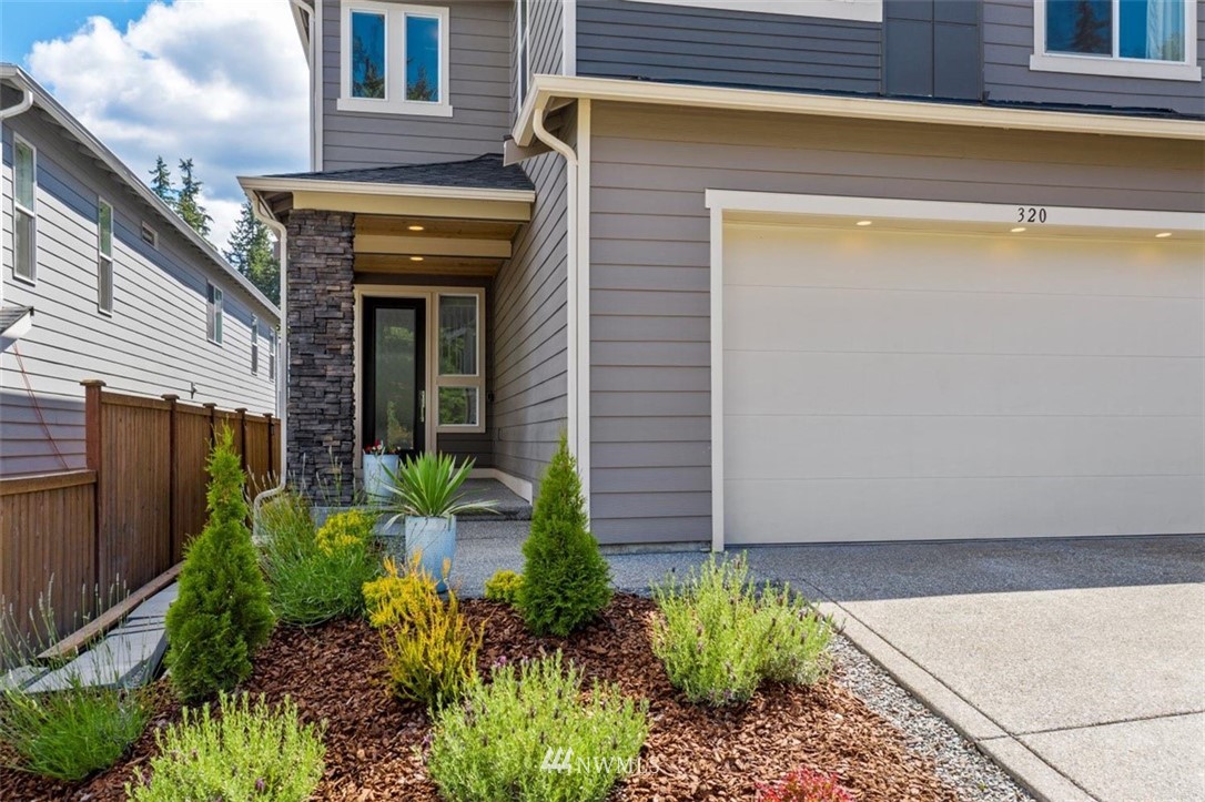 320 181st Street Southeast Bothell, WA 98012 - Photo 2 of 40 a view of a backyard with plants