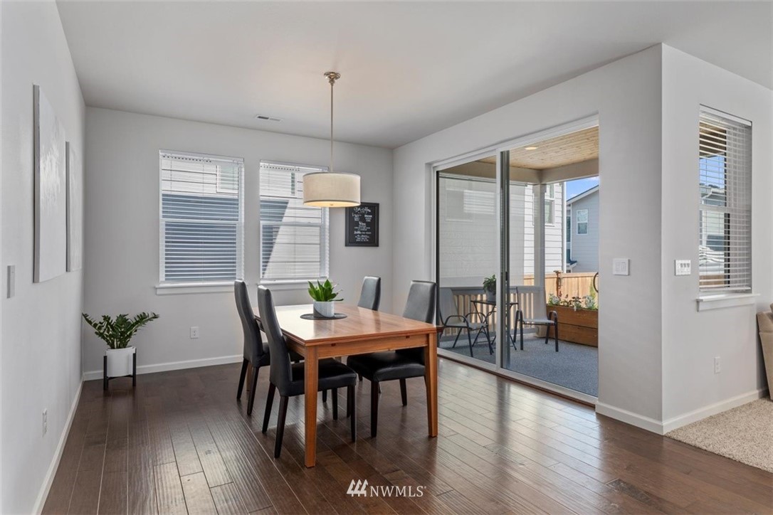 320 181st Street Southeast Bothell, WA 98012 - Photo 14 of 40 a view of a dining room with furniture window and wooden floor
