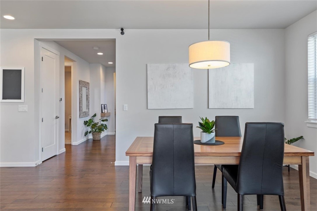 320 181st Street Southeast Bothell, WA 98012 - Photo 15 of 40 a view of a dining room with furniture wooden floor and chandelier