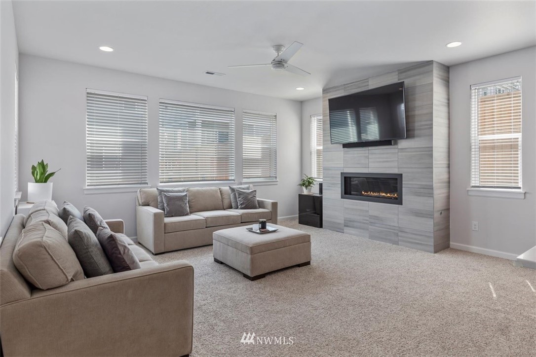 320 181st Street Southeast Bothell, WA 98012 - Photo 16 of 40 a living room with furniture and a fireplace