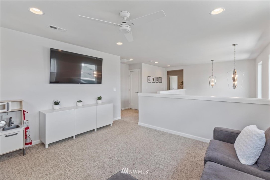 320 181st Street Southeast Bothell, WA 98012 - Photo 21 of 40 a living room with furniture and a flat screen tv