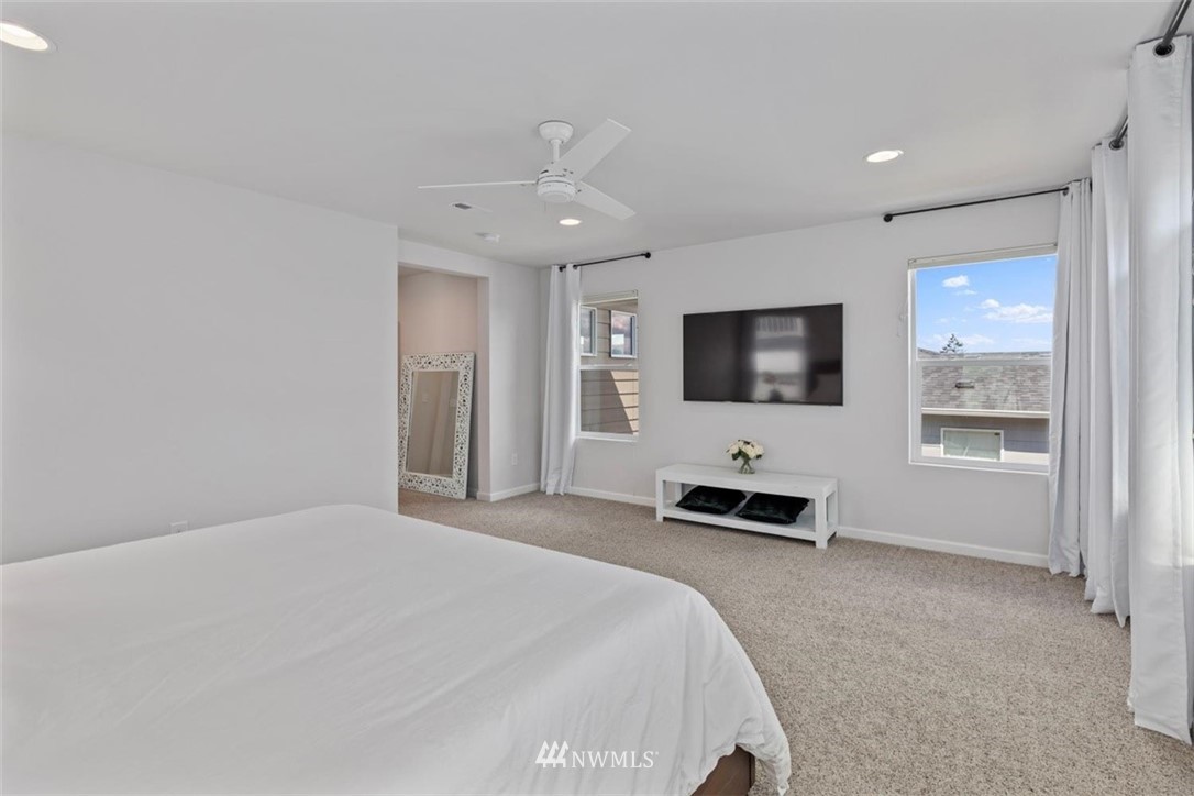 320 181st Street Southeast Bothell, WA 98012 - Photo 23 of 40 a bedroom with a bed and a flat screen tv