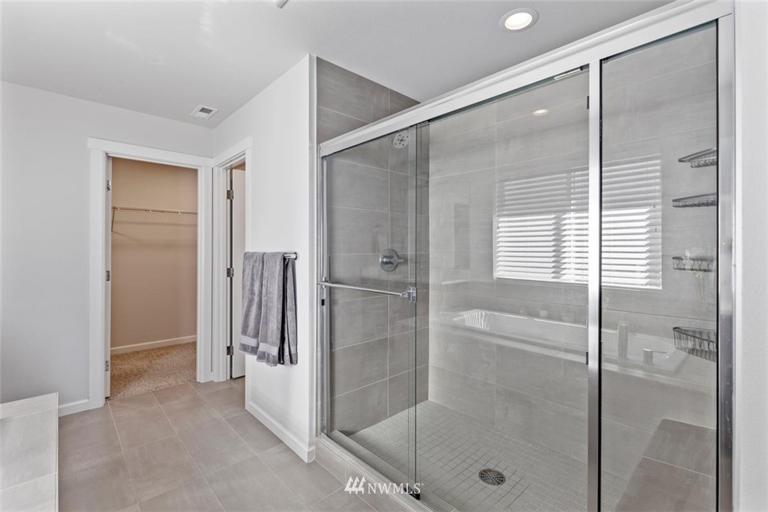 320 181st Street Southeast Bothell, WA 98012 - Photo 25 of 40 a bathroom with a shower and a glass door