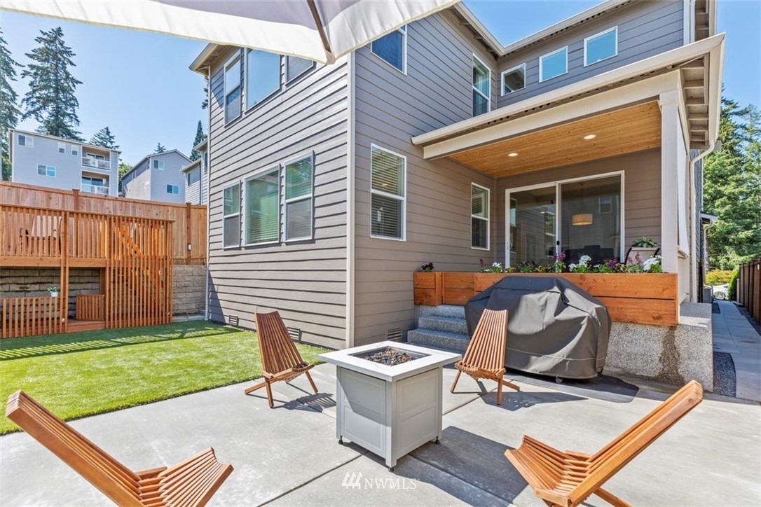 320 181st Street Southeast Bothell, WA 98012 - Photo 34 of 40 a view of a chair and table in backyard of the house