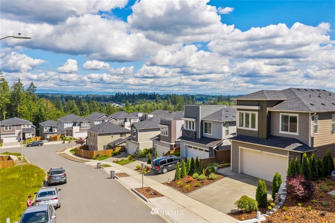 320 181st Street Southeast Bothell, WA 98012 - Photo 38 of 40 a view of a terrace with lawn chairs and iron fence