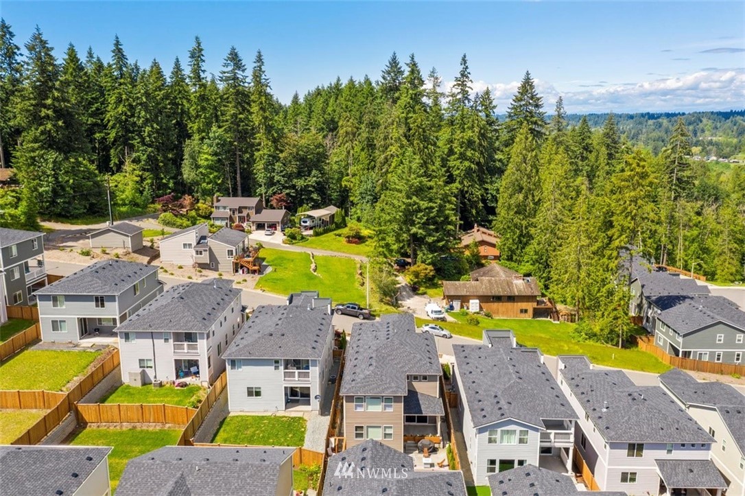 320 181st Street Southeast Bothell, WA 98012 - Photo 39 of 40 an aerial view of a house with a swimming pool outdoor seating and yard