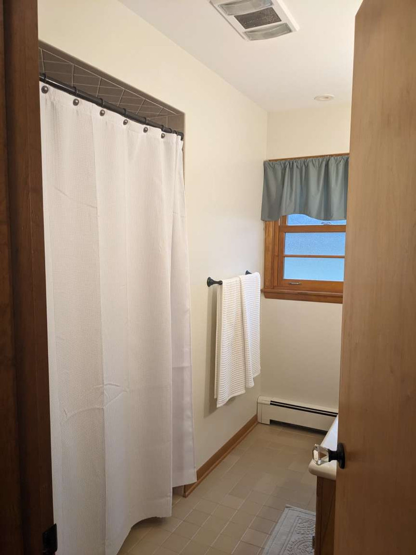 N352 Willow Road Wheaton, IL 60187 - Photo 11 of 25 a view of a room with wooden floor and a window