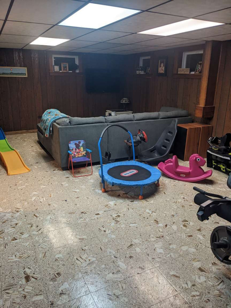 N352 Willow Road Wheaton, IL 60187 - Photo 20 of 25 a room with storage and a table