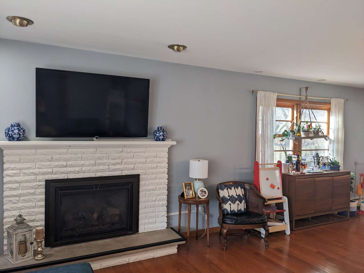 N352 Willow Road Wheaton, IL 60187 - Photo 4 of 25 a living room with furniture fireplace and flat screen tv