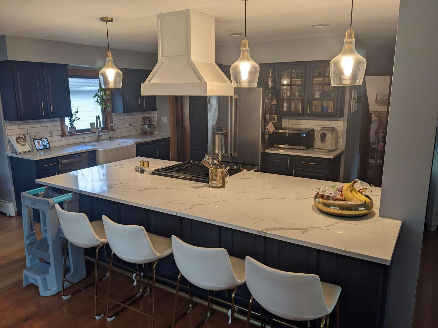 N352 Willow Road Wheaton, IL 60187 - Photo 5 of 25 a kitchen with stainless steel appliances granite countertop a table chairs and a refrigerator